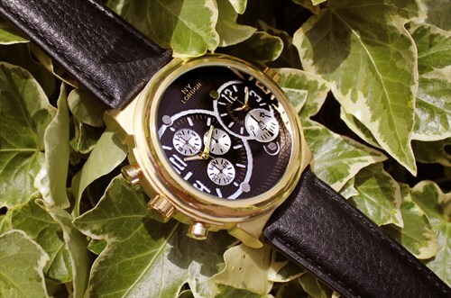 Gold dual time watch with date