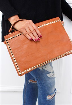 tan and gold clutch bag