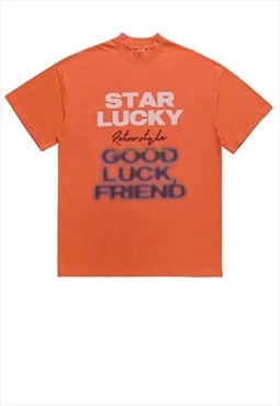 Graffiti t-shirt star slogan tee retro pop art top in orange
