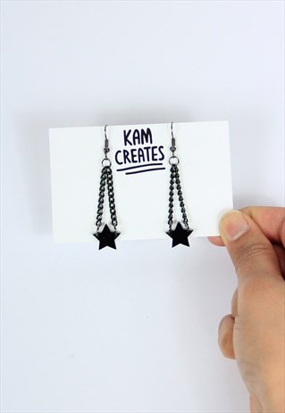 FUN STAR DANGLE EARRINGS IN BLACK