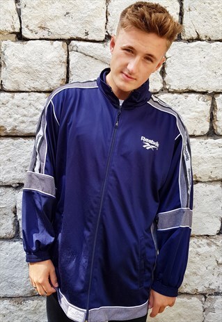 VINTAGE REEBOK TAPED SPELLOUT TRACK JACKET BLUE