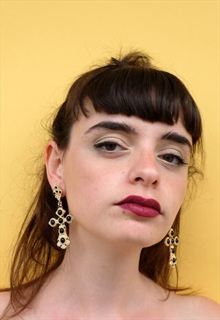 OVERSIZED GOLD CROSS EARRINGS.