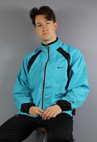 VINTAGE NIKE WATERPROOF WINDBREAKER JACKET IN BLUE WITH EMBR