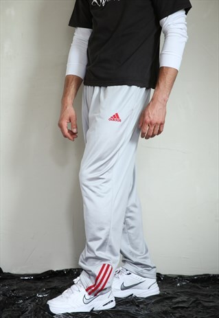 VINTAGE SILVER ADIDAS TRACK PANTS WITH RED STRIPES . UNISEX