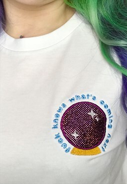What's Coming Next Crystal Ball Embroidered Tshirt
