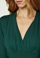 GREEN LONG SLEEVE FAUX WRAP TOP IN STRETCH JERSEY SUSTAINABL