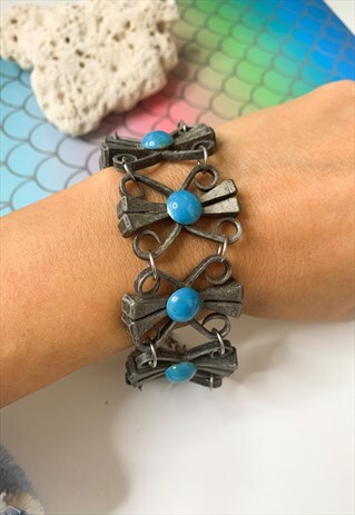 1960'S ORNATE SILVER AND TURQUOISE STATEMENT BRACELET