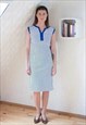 White sleeveless dress with blue dots