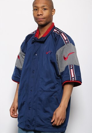 VINTAGE NIKE SHORT SLEEVED TAPE LOGO TRACK JACKET BLUE