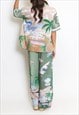 PALM PRINT BLOUSE AND FLARE TROUSER SET IN GREEN