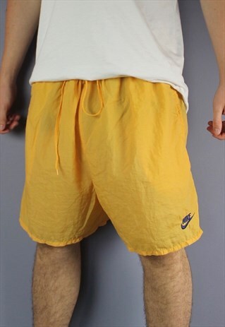 VINTAGE NIKE SHORTS IN ORANGE/PEACH WITH POCKETS, PRINTED LO