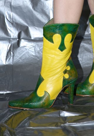 NEON YELLOW COWBOY ANKLE BOOTS WITH SNAKESKIN ELEMENTS .