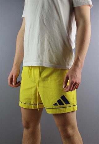 VINTAGE ADIDAS SHORTS IN YELLOW WITH POCKETS, PRINTED LOGOS