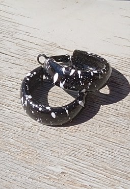 Black/white painted sprinkles enamel hoop earrings.