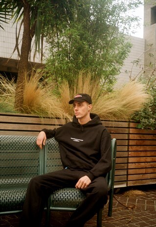 BLACK HOODIE WITH EMBROIDERED 'UK BORN, WORLDWIDE WORN' LOGO