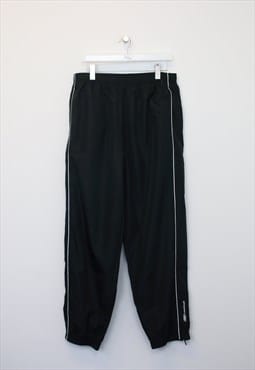 Vintage Reebok track pants in black. Best fits XL