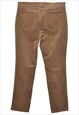 BEYOND RETRO VINTAGE CHAPS TAPERED BROWN CORDUROYQ TROUSERS 