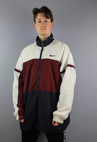 VINTAGE NIKE SHELL JACKET IN NAVY WITH EMBROIDERED LOGOS
