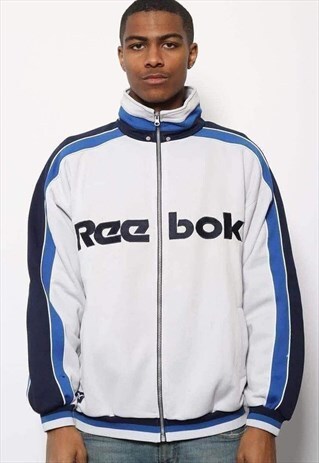 VINTAGE REEBOK SPELLOUT TRACK JACKET BLUE AND WHITE