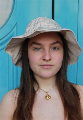 GREY VISOR HAT WITH FLOWER BROOCH