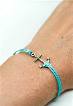 Silver anchor bracelet with a turquoise cord, nautical
