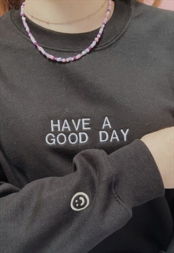 embroidered 'have a good day' smiley face sleeve crew neck