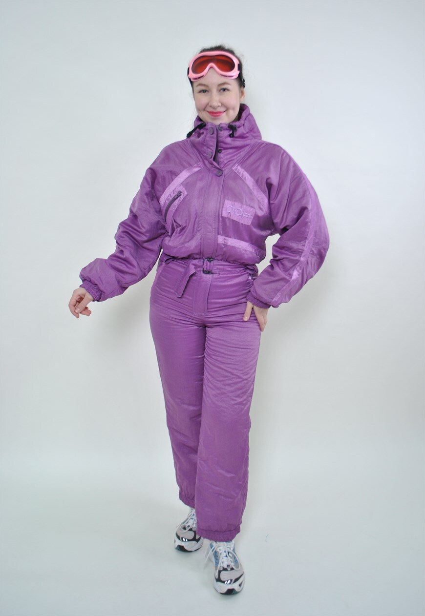 purple one piece ski suit