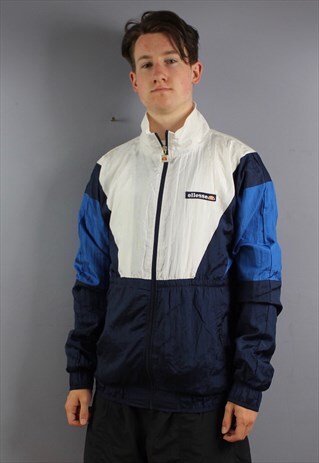 VINTAGE ELLESSE SHELL WINDBREAKER IN NAVY WITH EMBROIDERED L