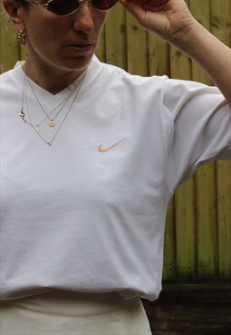 Vintage 1990s Nike t shirt with blush swoosh in white