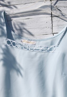 Vintage blue embroidered sleeveless top.