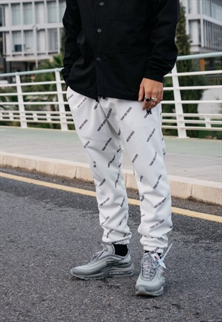 HANDMADE SWEATPANTS IN BEIGE WITH YOUR EGO SUCKS PRINT