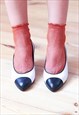 White and black colour block pointed vintage heels