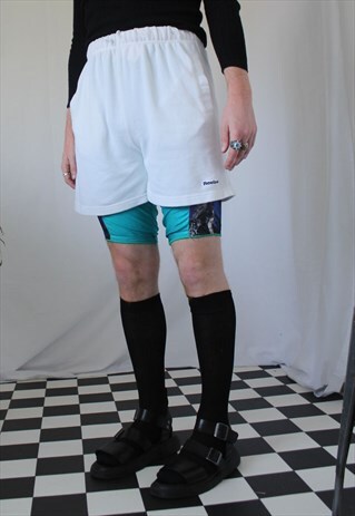 1990S VINTAGE REEBOK OVERSIZED SPELLOUT WHITE SHORTS