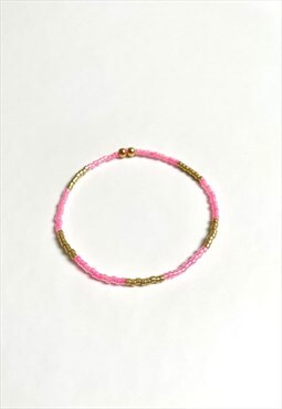 Pink and gold elastic beaded bracelet. Handmade item.