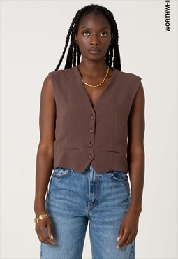 V-neck brown vest. Front with piping pockets