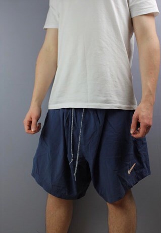 VINTAGE NIKE SHORTS IN NAVY WITH PRINTED LOGOS, POCKETS