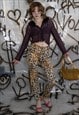 VINTAGE Y2K TACKY LEOPARD SKINNY TROUSERS IN BLACK & GOLD