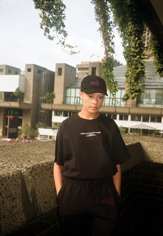 BLACK T-SHIRT WITH EMBROIDERED UK BORN, WORLDWIDE WORN LOGO