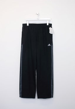Vintage Adidas track pants in black. Best fits L
