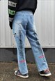 Ripped jeans distress denim paint splatter graffiti overalls