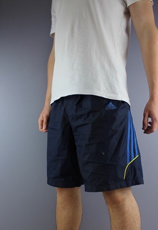 VINTAGE ADIDAS SHORTS IN NAVY WITH POCKETS AND PRINTED LOGO.