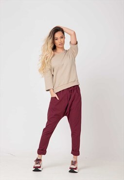 Drop crotch trousers in slim fit leg and large front pockets