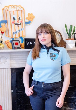 POLO SHIRT IN BLUE WITH FAIRY CREST PRINT