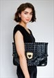 Large black clutch bag by Alexander McQueen