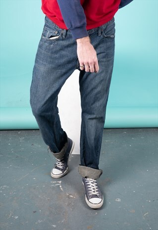 VINTAGE LEVI'S 514 JEANS IN BLUE DENIM WITH RIPS