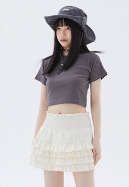 Pleated mini skirt in cream