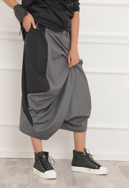 Cropped drop crotch trousers with side pockets 