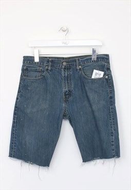 Vintage Levi's denim cut off shorts in blue. Best fits W32"