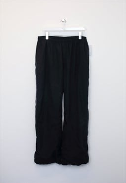 Vintage Reebok track pants in black. Best fits XXL