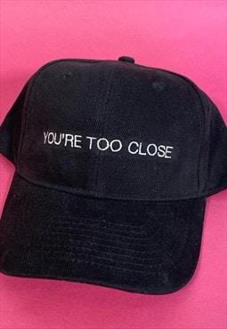 you're too close slogan cap - black